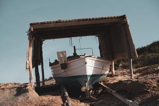 Fisherman's boat on the beach of Illetes in Formentera, Spain.