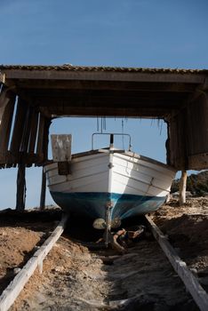 Fisherman's boat on the beach of Illetes in Formentera, Spain.