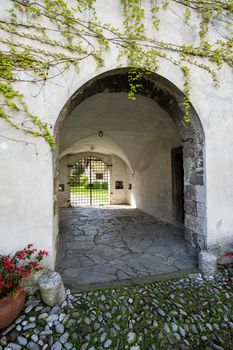 Gorizia, Italy. May 21, 2021. the arched entrance passage of the ancient Lantieri palace in the historic center of the city