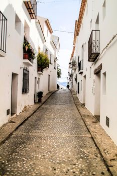 Narrow streets and beautiful whitewashed facades in Altea village, Alicante, Spain