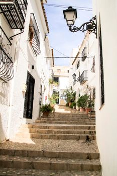 Narrow streets and beautiful whitewashed facades in Altea village, Alicante, Spain