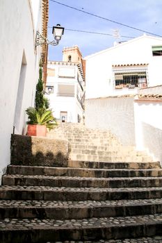 Narrow streets and beautiful whitewashed facades in Altea village, Alicante, Spain