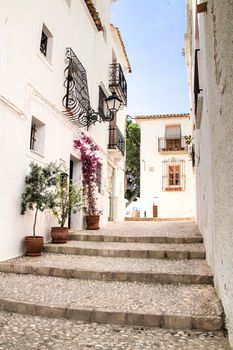 Narrow streets and beautiful whitewashed facades in Altea village, Alicante, Spain