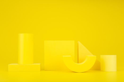 Abstract yellow monochromatic background composition with yellow geometric figures against yellow background with copy space