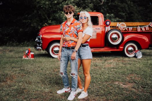 Couple in a vintage red truck