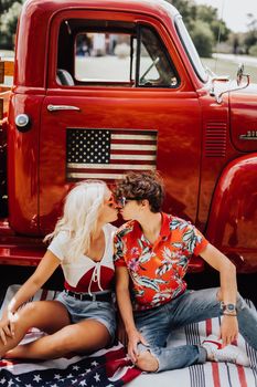 Couple in a vintage red truck