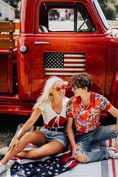 Couple in a vintage red truck