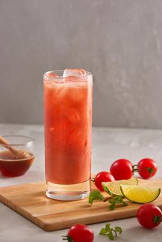 Glass of tomato juice with ice