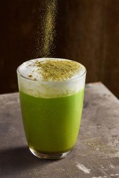 Matcha green tea latte in glass cup