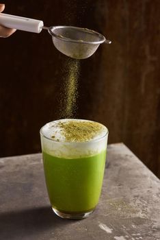 Matcha green tea latte in glass cup