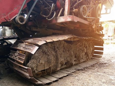 Close-up of Crawler tracks combine harvesters of The machine for harvesting from the fields.