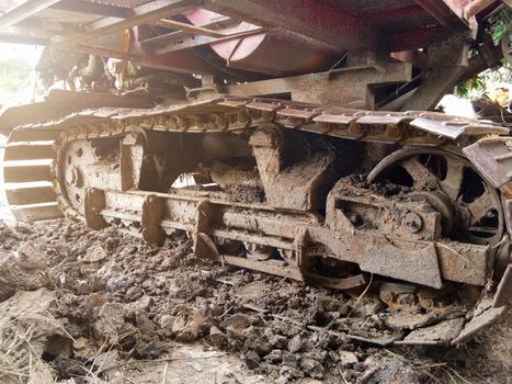 Close-up of Crawler tracks combine harvesters of The machine for harvesting from the fields.