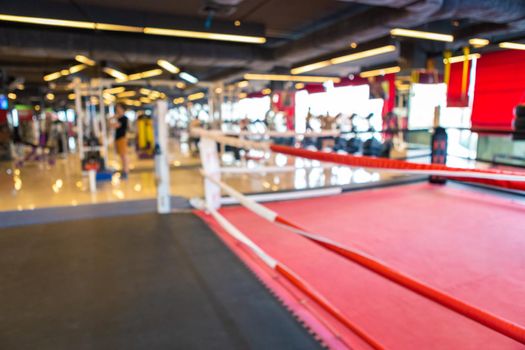 Abstract blur of defocused boxing gym interior and fitness health club with sports exercise equipment Gym blur background.