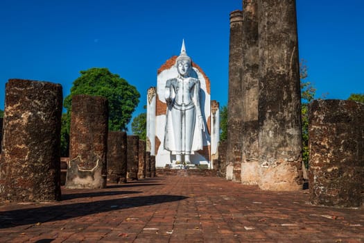 Ancient white buddha statue beautiful at sunset is a Buddhist temple It is a major tourist attraction in Phitsanulok, Thailand.