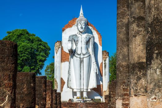 Ancient white buddha statue beautiful at sunset is a Buddhist temple It is a major tourist attraction in Phitsanulok, Thailand.