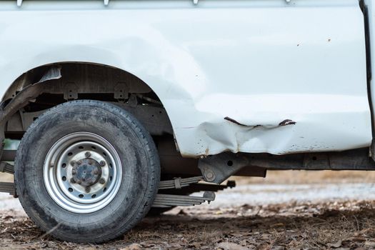 Closeup of a smashed of white car in an accident.