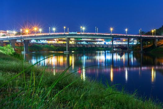 The color of Night traffic light on the road on the bridge (Eka Thot Sa Root Bridge) in Phitsanulok, Thailand.