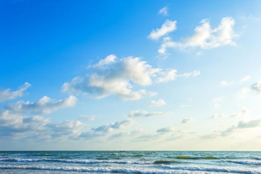 Beautiful early morning sunrise over the sea the horizon,blue sky background texture with white clouds sunset.