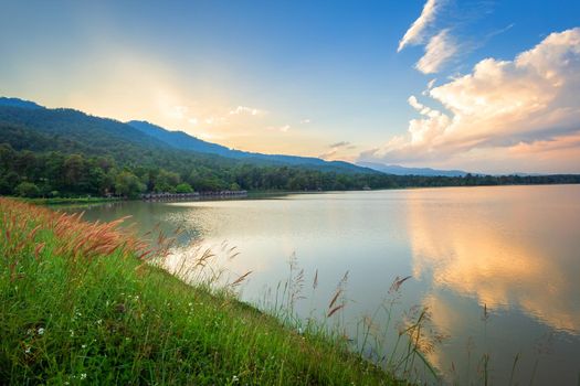 Scenic view of the reservoir Huay Tueng Tao with Mountain range forest at evening sunset in Chiang Mai, Thailand