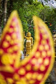 Buddha statue beautiful On the way up at The stone with the footprint of Lord Buddha at Khitchakut mountain It is a major tourist attraction Chanthaburi, Thailand.