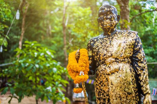 Buddha statue beautiful On the way up at The stone with the footprint of Lord Buddha at Khitchakut mountain It is a major tourist attraction Chanthaburi, Thailand.