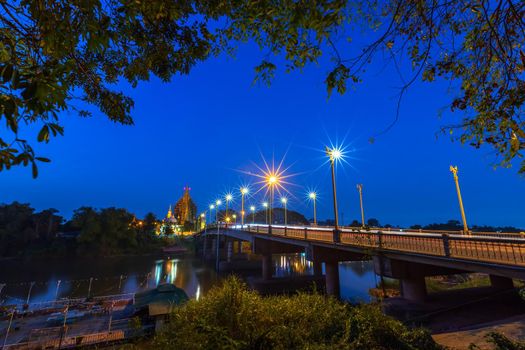 The color of Night traffic light on the road on the bridge (Suphankanlaya Bridge) in Phitsanulok, Thailand.