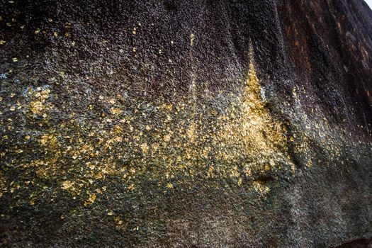 People traveling Gold Foil stick to worship The stone with the footprint of Lord Buddha at Khitchakut mountain It is a major tourist attraction Chanthaburi, Thailand.