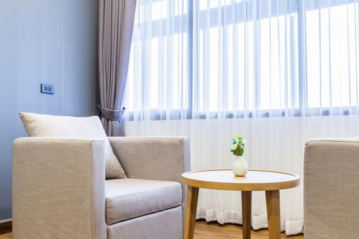 Close-up of sofa in hotel bedroom interior.