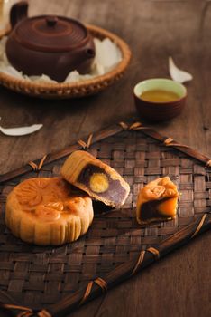 Festival moon cake and hot tea - Chinese cake. Text on cake mean happiness.