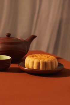 Mid-Autumn festival, an asian celebration, served with traditional mooncake. Text mean Happiness.