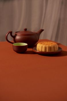 Mid-Autumn festival, an asian celebration, served with traditional mooncake. Text mean Happiness.