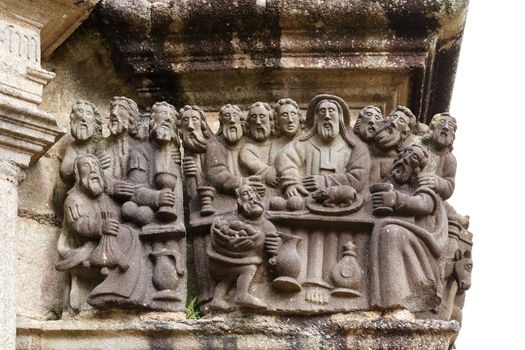 Last Supper - detail of scene on the stone Calvary in Parish close Guimiliau, Brittany, France