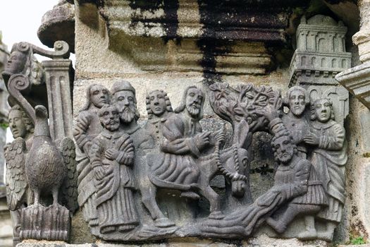 Entry to Jerusalem - detail of scene on the stone Calvary in Guimiliau Parish close, Guimiliau, Brittany, France