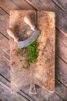 Preparation of chopped chives and chili on wooden-border