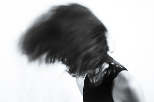 Motion blur portrait of woman over 40. Black tshirt