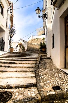 Narrow streets and beautiful whitewashed facades in Altea village, Alicante, Spain