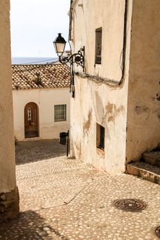 Narrow streets and beautiful whitewashed facades in Altea village, Alicante, Spain