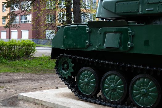 Close-up of tank parts, iron wheels, tank track, tank undercarriage, metal wheels of combat power.