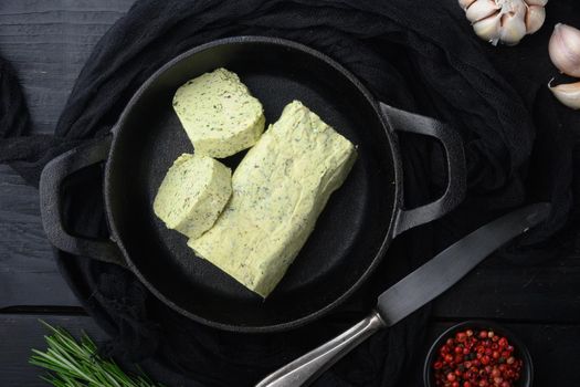 Organic Butter with a herb for sandwiches and steak set, on black wooden table background