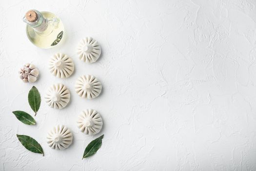 Khinkali, Georgian dumplings, traditional Georgian cuisine set, on white stone surface, top view flat lay, with copy space for text