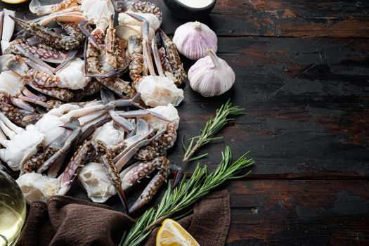 Fresh raw Blue Swimming Crab ocean gourme parts set, on dark wooden background , with copyspace and space for text