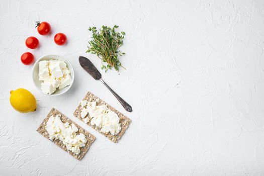 Crisp bread sandwich set, square format, on white stone table background, top view flat lay, with copy space for text