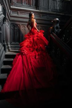 Woman Vintage Red Dress Old Castle Beautiful Princess In Seductive Dress Elegant Caucasian Female Fairy Tale story Dark Stairs