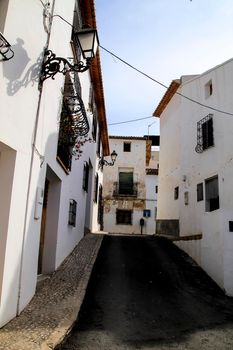 Narrow streets and beautiful whitewashed facades in Altea village, Alicante, Spain