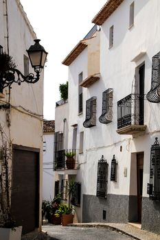 Narrow streets and beautiful whitewashed facades in Altea village, Alicante, Spain