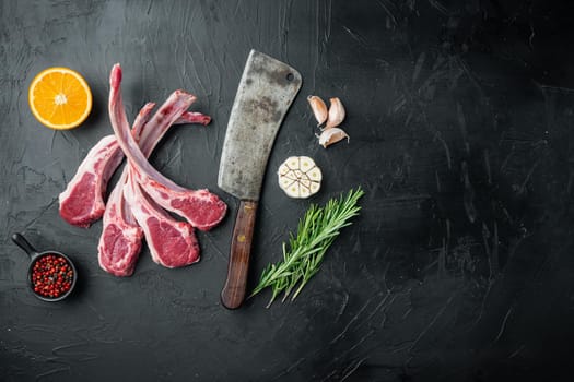 Fresh lamb cutlet. Organic meat steak set, with ingredients carrot orange, herbs, on black stone background, top view flat lay , with copyspace and space for text