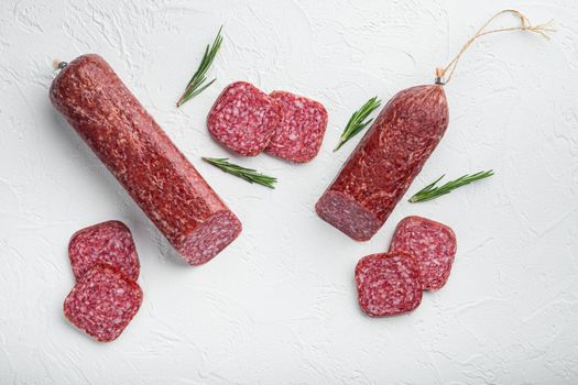 Salami with ingredients set, on white stone table background, top view flat lay