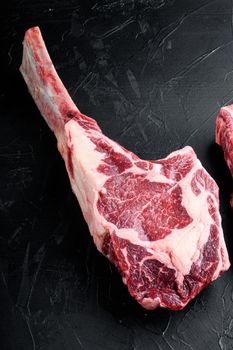Barbecue Tomahawk marbled beef Steak set, on black stone background, with copy space for text