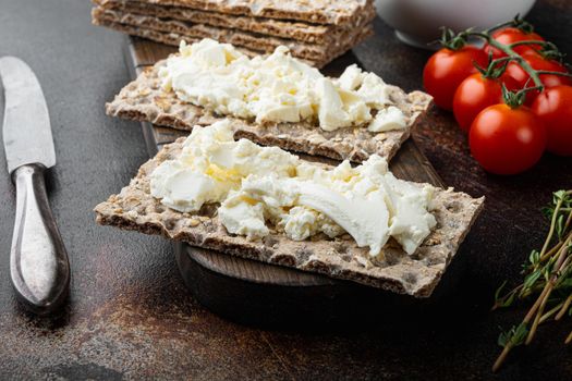 Crisp bread sandwich set, on old dark rustic table background