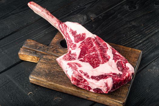 Barbecue Tomahawk marbled beef Steak set, on black wooden table background